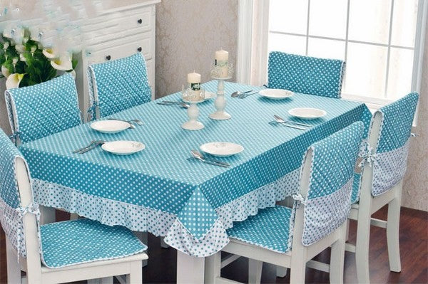 Dining table Set of 6,Stools covered by the blue ball covers,held by the blets,Wooden dining Tables,Kitchen Forks and Knives,Dishes on the Table